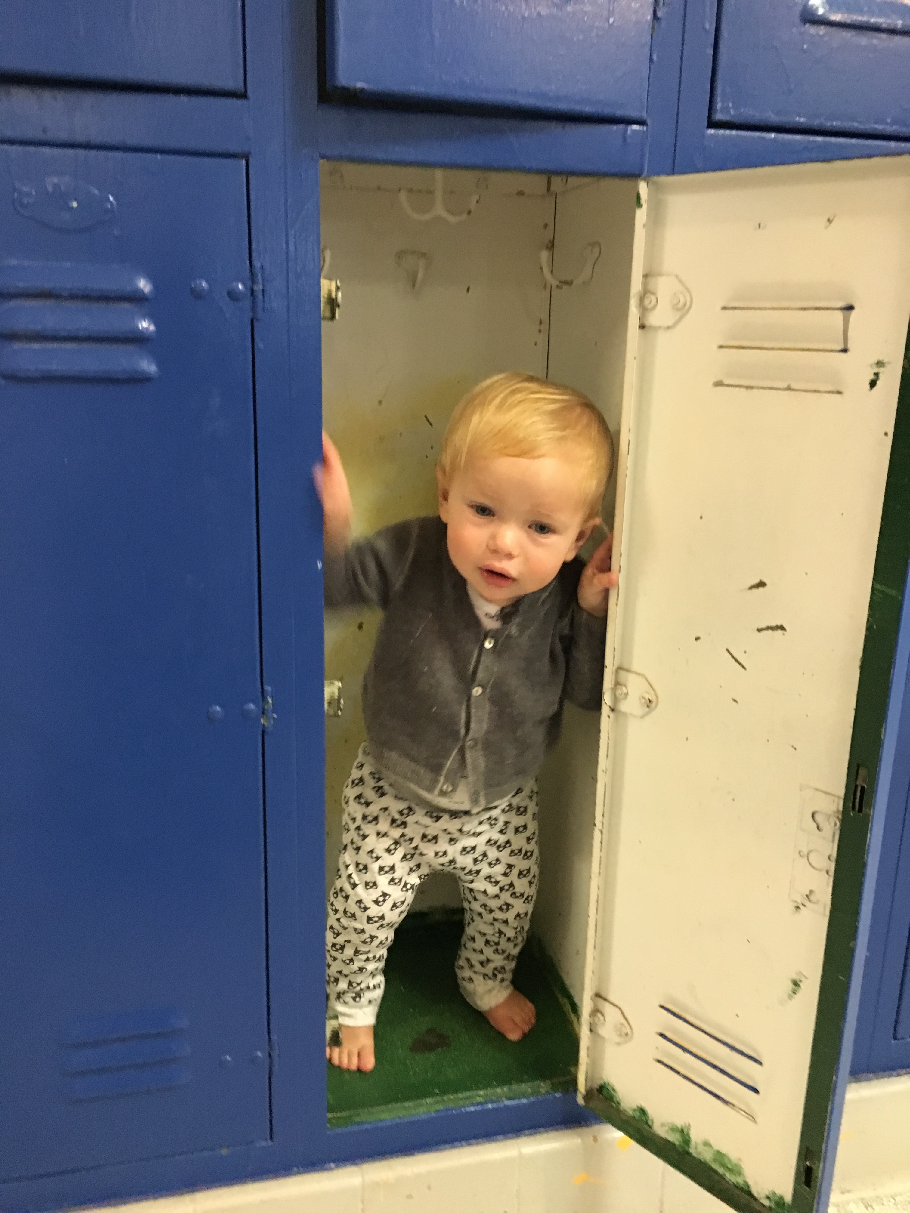 Weston peeking out from locker